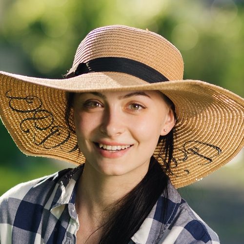 Residential lawn service expert watering summer garden