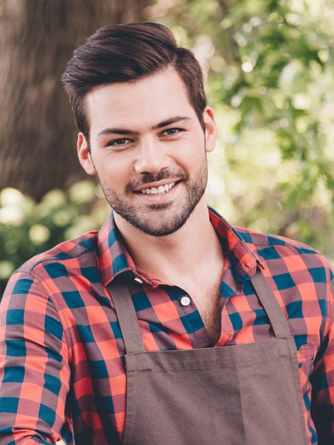 Portrait of gardener from organic lawn care company